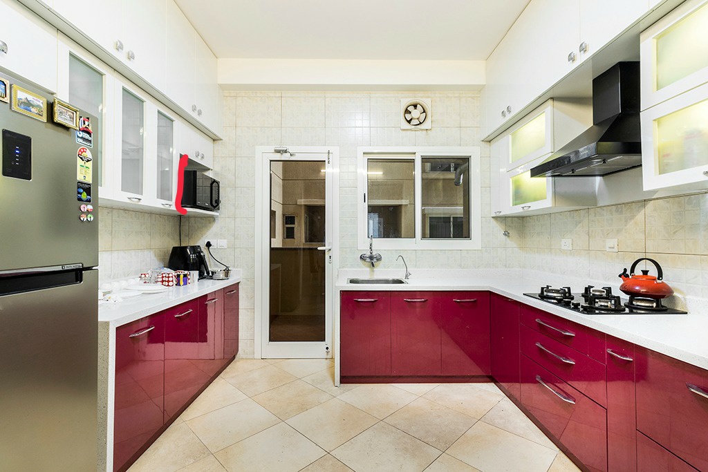 Glister Interior Modular kitchen Design red colour